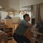 Man dancing with fridge